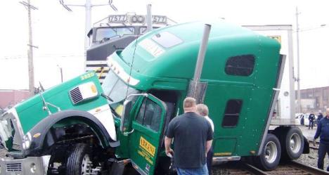 Truck struck by train, photo by Cleveland FD